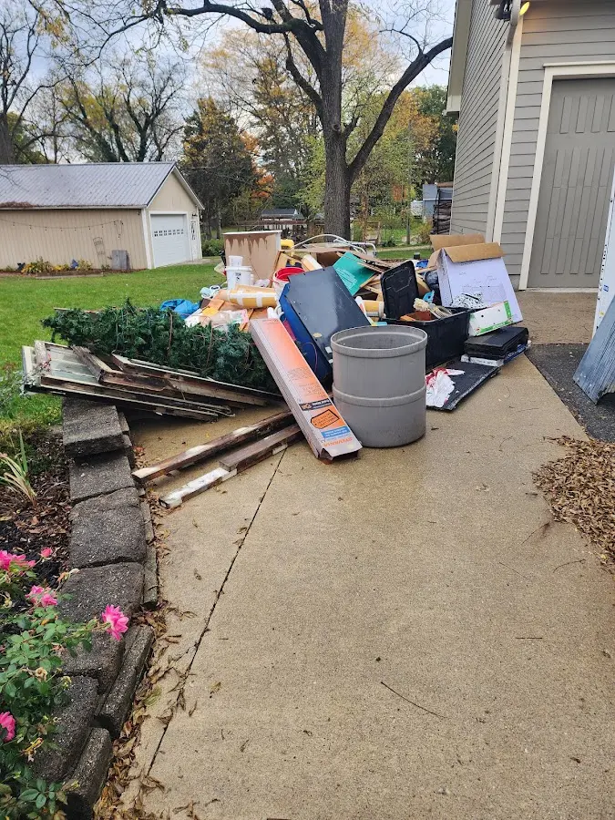 Dumpster being loaded with debris for 30 Yard Dumpster Rental in Bandon